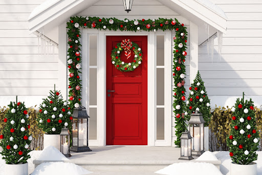 a holiday home with a red door decorated with ornaments
